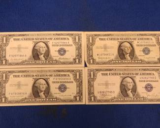 Lot 401. Four $1 Silver Certificates