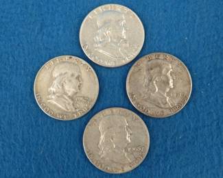 Lot 474. Four Franklin silver half dollars