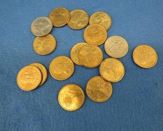 Lot 34. Sixteen dollar coins including gold-colored presidential coins, Sacagawea, and Susan B. Anthony