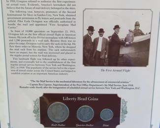Lot 340. 1911 Liberty Head half, quarter and dime presented in a display that includes a historic photograph and historical comment.
