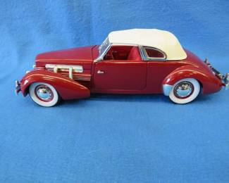 Lot 63. Signature model 1937 Cord 812 super Charged.&nbsp; 1:18 scale die-cast car with box.