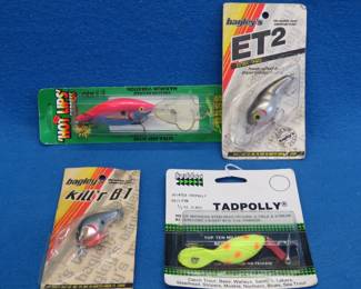 Lot 185. Four vintage lures in the original packaging