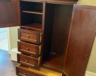 Opened up. Right side has shelves or hanging rod!