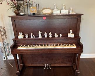 Antique upright piano - covered with....