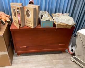 Dolls fill a bag, trunk/cedar chest $20