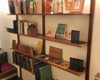 Teak wall unit (shelf) - as shown: 63”W, 9”D”, 77”H. Shelves are actually 2 pieces - total of 8 shelves, each 31.5” long. They could be staggered on vertical supports.