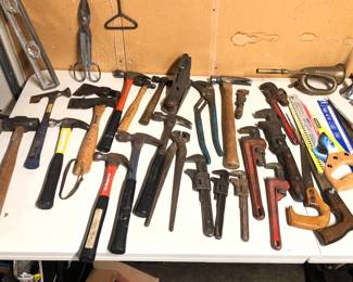 Hand tools: hammers, wrenches, saws