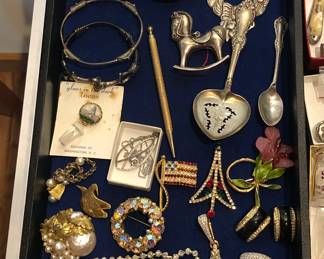 Sterling ornaments, costume jewelry including Miriam Haskell & DeNicola brooches, Dior earrings, rhinestones, sterling spoons & more