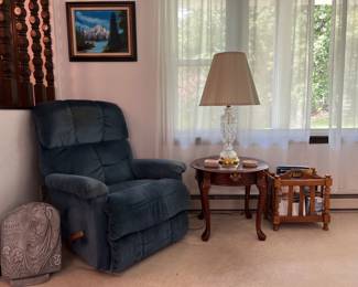 recliner, cherry table, crystal lamp, garden stone