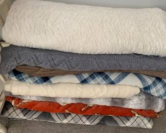 a sampling of throws of many different fabrics