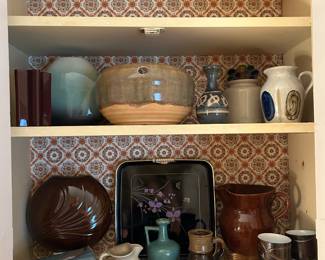 Many pieces of vintage pottery.