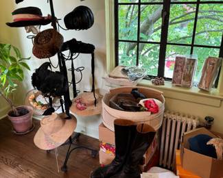 Two incredible, notable vintage hat stands, 1 black, wrought iron, standing store stand and a to-die-for 1950s lucite table top stand. Drool worthy!! Also over a dozen table top hat stands too, all vintage or antique. Pair of Cydwoq tall boots, women’s size 41, 9. Clothing brush on window sill. Box of celluloid and bakelite buckles. 