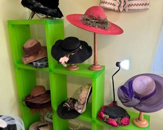 Design Within Reach, Cubitec modular shelving system.
Beautiful selection of oversized Victorian and vintage hats. Intricate sewing, incredible amount of handwork on these. Green cube shelving is for sale too, but must be picked up later, Friday afternoon. Hanging above is a darling west Germany vintage wool sweater with mother of pearl shell buttons, sweater is in mint condition. 