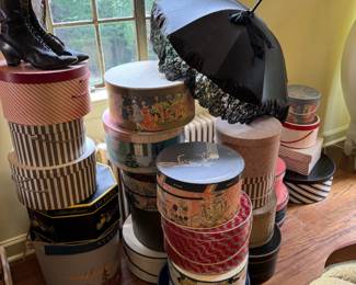 Over a dozen fun vintage hat boxes, several of them having local Midwest shops and cities on them. Victorian pair of leather boots. Lovely antique Victorian mourning umbrella. 