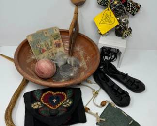 A Collection Of Intriguing Oddities: Voo Doo Doll, Spoon, Toy Snake & More	
