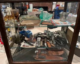 Hunting knives, pocket knives, glass swans, vintage pellet guns, 1943 Boy Scout book