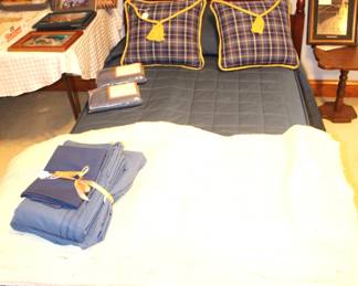 Twin bed, two head boards, bedding.