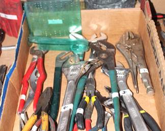 Various pliers and wrenches.