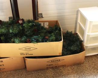 Christmas garland with lights. Three drawer storage bins.