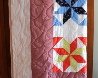 Machine stitched quilt.