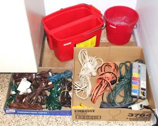 Variety of extension cords and plastic buckets.