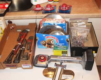 Saw blades, monkey wrenches, 2 paddle shower sprayer, and carpet knee kicker.