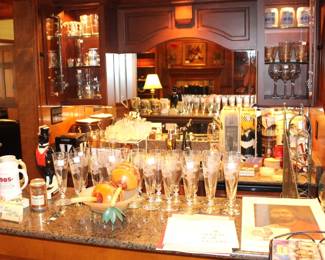 The bar area is full of bar items and glassware.
