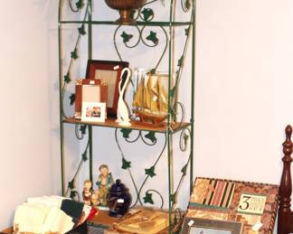 Table is full of linens, decorative objects, pictures and more.