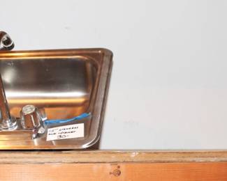 Small sink with faucet.
