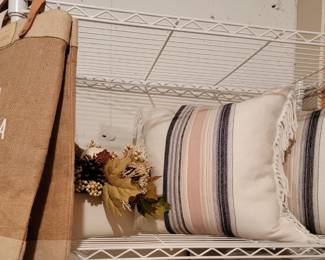 Just a few of the really cute pillows for sale. Several of these tall shelving units are available in white, chrome and black.