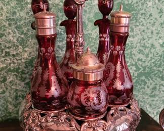 Antique silverplate cruet set with red cut to clear inserts