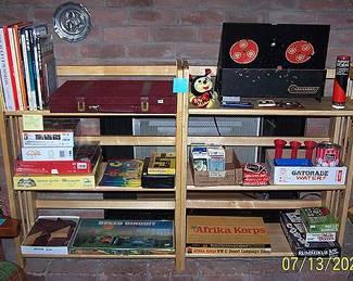 Folding bookshelves, music books, assorted board and card games, puzzles, Marksman moving target