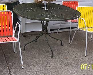 Colorful vintage patio chairs, metal patio table