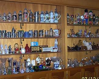 Wall shelf containing stein collection, Nutcrackers, Steinbach music boxes, wood animals, etc....