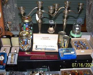 Marbles, Sterling candelabras, razors, etc...