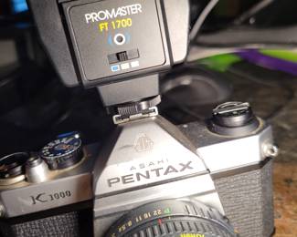 Pentax K100 SLR camera with Promaster flash