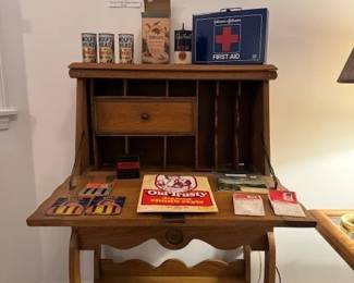 Vintage 1920'2 secretary displaying colectibles