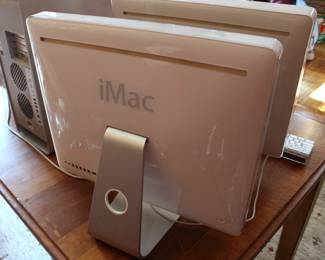 Backside of the two iMac 2006 all-in-one desktop computers