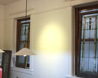 Three matching leaded glass windows, 57" tall and 19 3/4" wide, with original locking brass slides still attached.