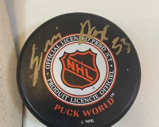 Signed Chicago Blackhawks hockey puck, Chris Chelios #7 and Scott Darling #33