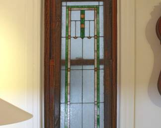 One of the three matching leaded glass windows, 57" tall and 19 3/4" wide, with original locking brass slides still attached.