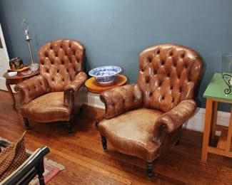 Another view of the pair of Ralph Lauren Home button tufted leather chairs (one seat with tear)