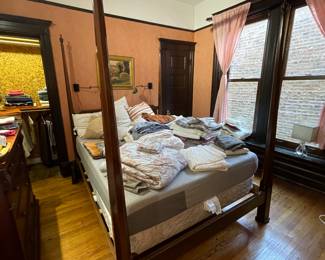 Queen sized four poster bed shown with LOTS of home textiles