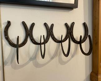 Antique Wrought Iron Horseshoes mounted as a hat rack