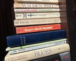 Books including "Future Shock", "Ordinary People" by Judith Guest, "Walden Two" by Skinner, "The Human Comedy" by William Saroyan, "Eye of the Needle" by Ken Follett, "The Reivers" by William Faulkner, Roget's College Thesaurus, The Holy Bible, "On Liberty by Mill, "Blues" by John Hersey, "Before I Go to Sleep"