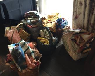 Baskets full of good sized useable vintage fabrics