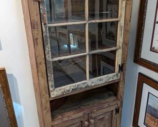 Lot 106: Antique cabinet featuring wooden shelves behind single glass door and storage behind two closed doors; 64 " high x 29 " wide x 11 " deep