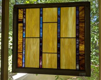 Lot 610: Leaded stain glass panel in antique window; measures 31 " high x 34 " wide