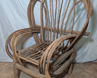 Lot 646: Artisan made branch chair; fan back measuring 46.5 " high and armchair measuring 37 " wide