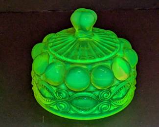 Lot 759: Uranium glass butter domes and one under tray measuring 7.5 " diameter